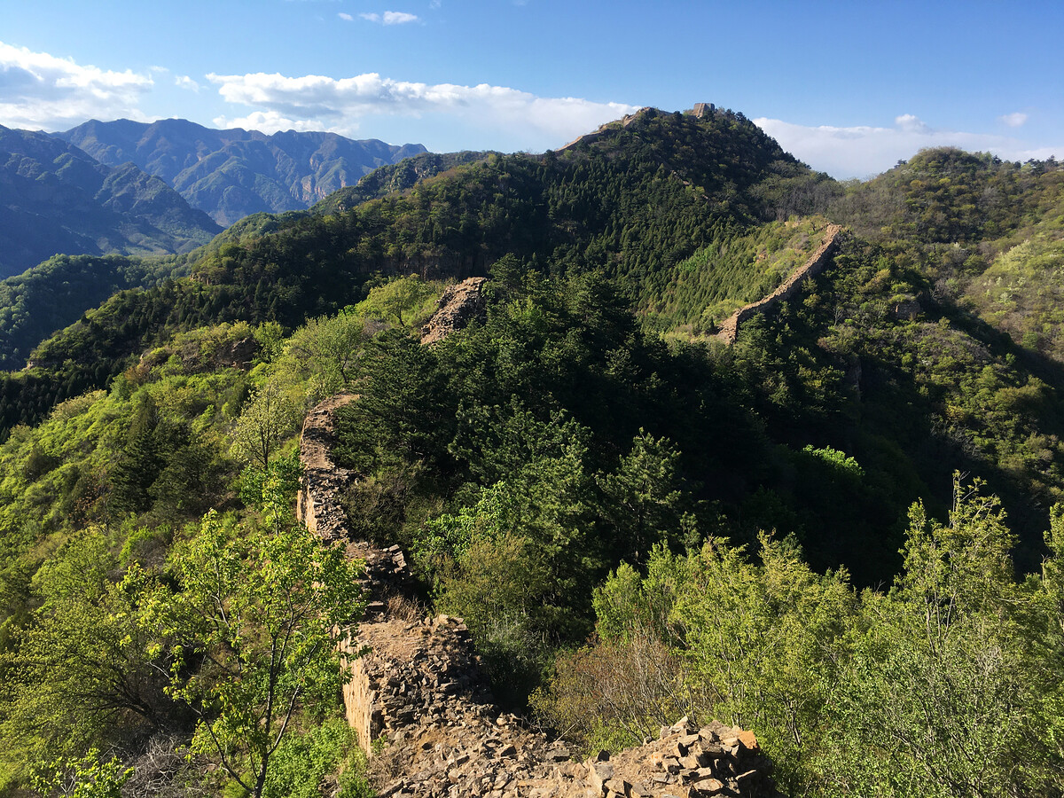 Great Wall leads towards a high peak.