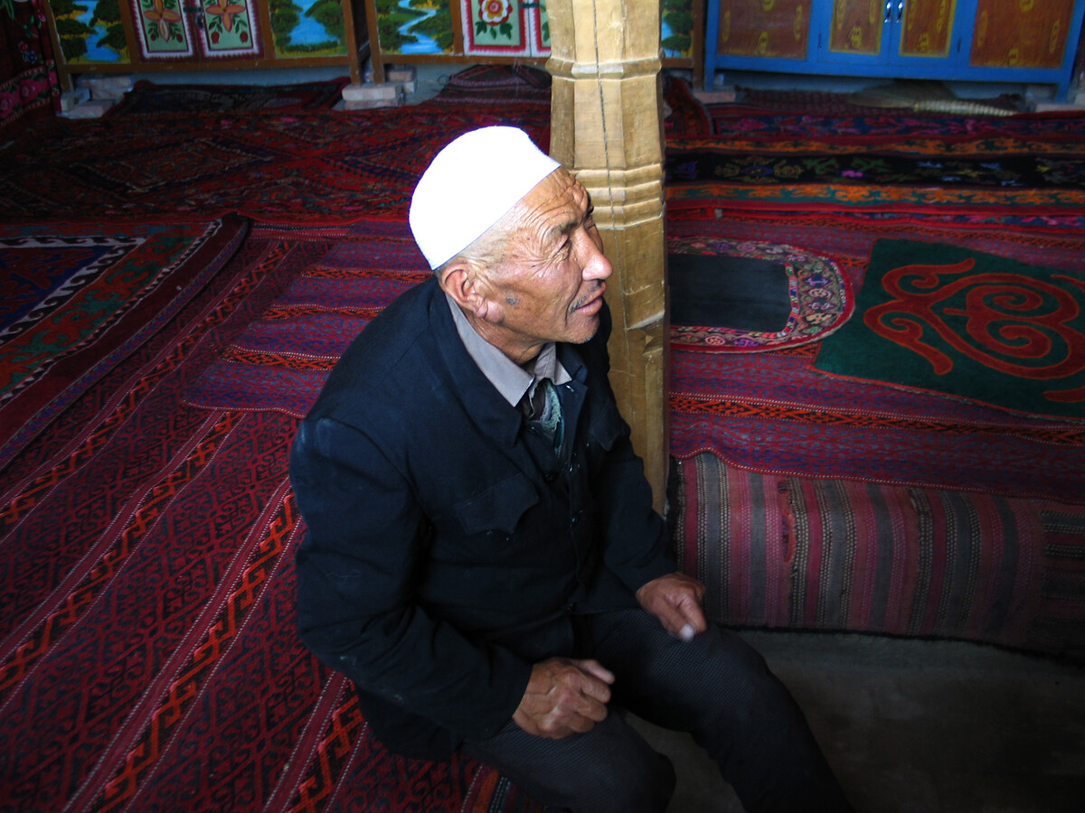 A man sitting on the carpets