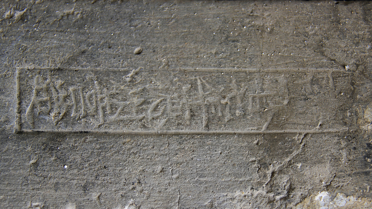Stamp in a brick.