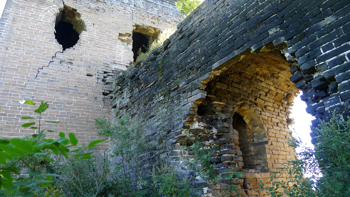 A large arch in the base of the Great Wall.