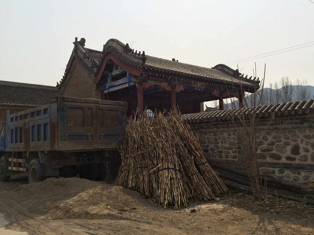 Straw stacked outside a temple