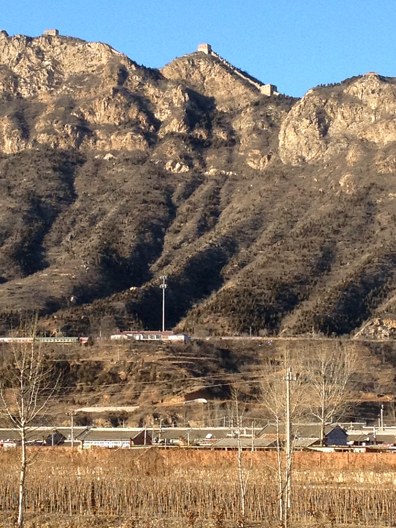Great Wall towers atop tall cliffs, the old Gubeikou railway station below