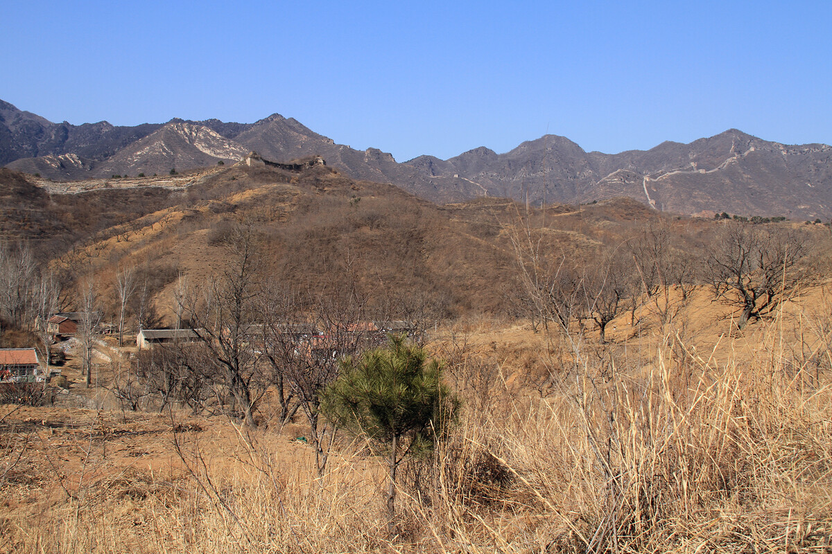 Great Wall on the ridge above Lower Kongtai Village, with more wall seen in the distance.