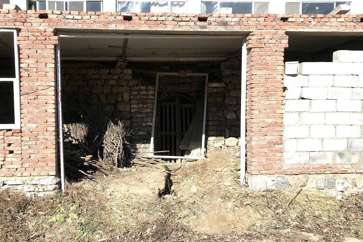 Door to a cellar below a house