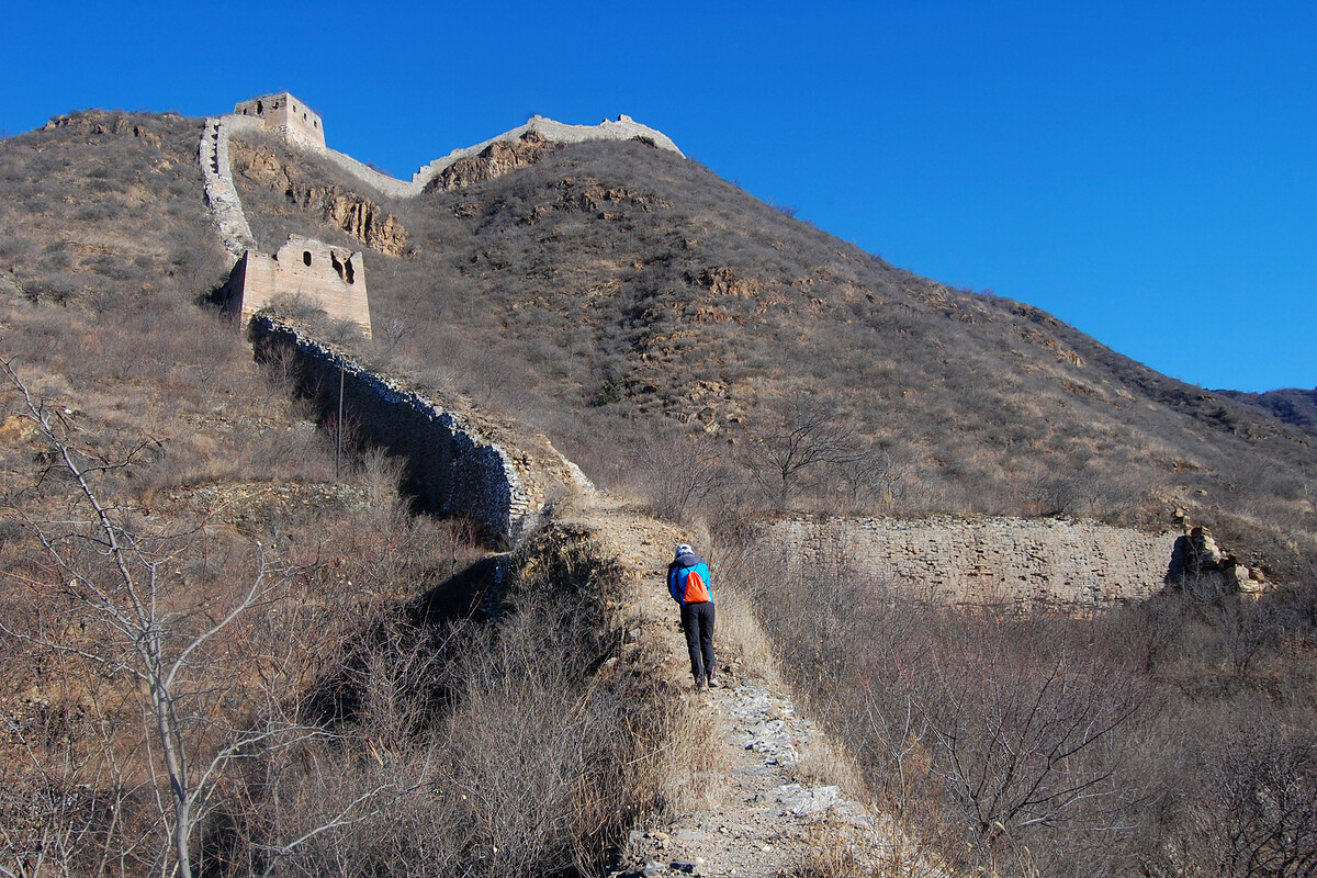 Great Wall towers and a hiker
